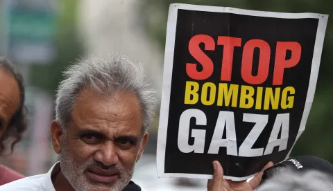 epa12261105 A civil society activist holds a placard during a rally in solidarity with the Palestinian people, amidst the ongoing conflict in Gaza, in Karachi, Pakistan, 25 July 2025. At least 113 Palestinians, including more than 80 children, have died due to famine and malnutrition in the Gaza Strip, according to the Palestinian Ministry of Health. EPA/SHAHZAIB AKBER