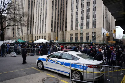 epa10558810 Demonstrators outside New York Criminal Court as former US President Donald J. Trump is arraigned in New York, New York, USA, 04 April 2023. A Manhattan grand jury voted to indict former President Donald J. Trump last week. EPA/WILL OLIVER