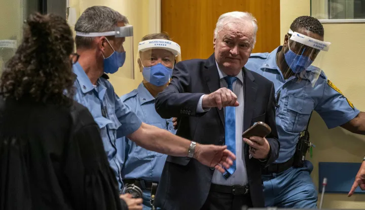 epa09254887 Former Bosnian Serb military chief Ratko Mladic in the court room in The Hague, Netherlands, 08 June 2021, where the United Nations court delivers its verdict in the appeal of Mladic against his convictions for genocide and other crimes and his life sentence for masterminding atrocities throughout the Bosnian war. EPA/Jerry Lampen/POOL