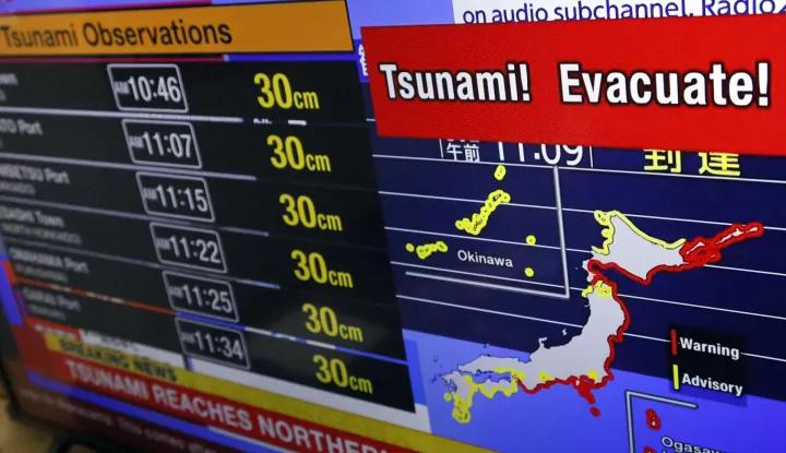 epa12271675 A television screen shows a news report from the Japanese Meteorological Agency following a 8.8 magnitude quake occured off the Kamchatka Peninsula, in Tokyo, Japan, 30 July 2025. The Japan Meteorological Agency issued a tsunami warning after the M8.8 quake hit off the Kamchatka Peninsula. EPA/JIJI PRESS JAPAN OUT EDITORIAL USE ONLY/