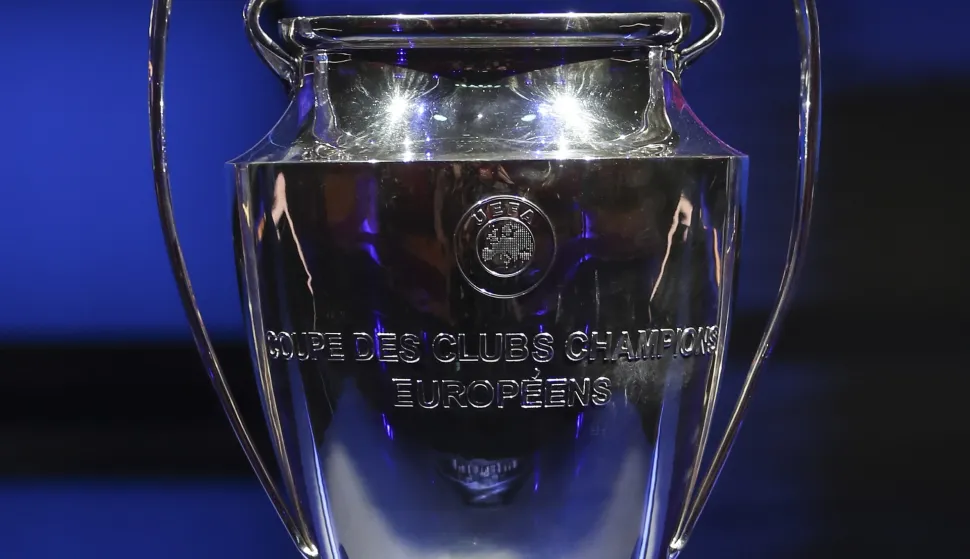 epa09430462 The Champions League trophy is on display during the UEFA Draw and Awards Ceremony at the Halic Congress Center in Istanbul, Turkey, 26 August 2021. EPA/TOLGA BOZOGLU