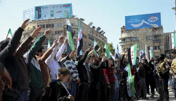A crowd waves flags and chants in a city square in Aleppo, Syria, on March 7, 2025. The gathering takes place after Friday prayers as citizens rally in support of the new government and its military operations against the ousted regime forces. Photo by Hibatullah Barakat/Middle East Images/ABACAPRESS.COM Photo: Middle East Images/ABACA/ABACA