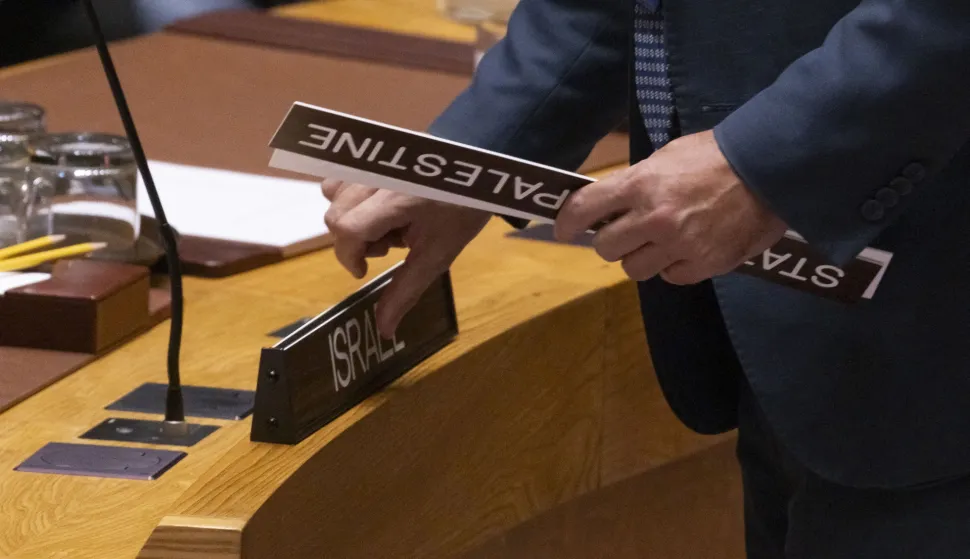 epa12285111 A United Nations staff member places name plates for Israel and Palestine at the start of an United Nations Security Council meeting on the conflict between Israel and Hamas at United Nations headquarters in New York, New York, USA, 05 August 2025. EPA/JUSTIN LANE