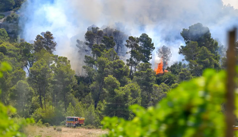 epa12288141 A fire engine operates as a forest fire continues to spread in Saint-Laurent-de-la-Cabrerisse, Aude department, southern France, 07 August 2025. Some 16,000 hectares have been burned so far and at least one person died in one of the biggest wildfires in France since 1949. EPA/PHILIPPE MAGONI