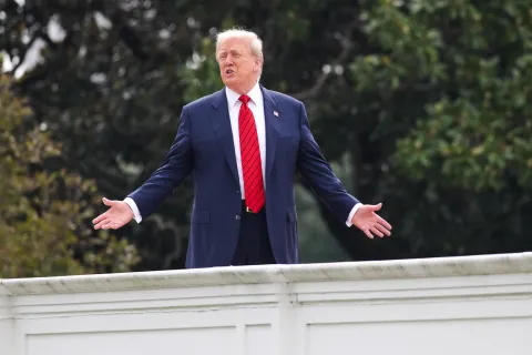 epa12284469 US President Donald J. Trump responds to a question from the news media as he tours the roof at the White House in Washington, DC, USA, 05 August 2025. President Trump has announced the construction of a new ballroom addition of approximately 90,000 total square feet of ornately designed and carefully crafted space, with a seated capacity of 650 people. EPA/SAMUEL CORUM/POOL