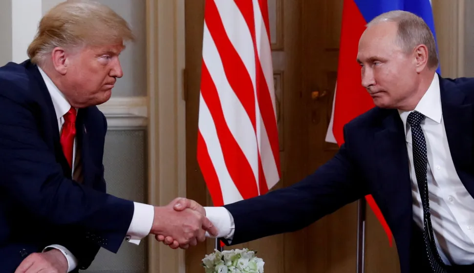 FILE PHOTO: U.S. President Donald Trump and Russia's President Vladimir Putin shake hands as they meet in Helsinki, Finland July 16, 2018. REUTERS/Kevin Lamarque/File Photo Photo: KEVIN LAMARQUE/REUTERS