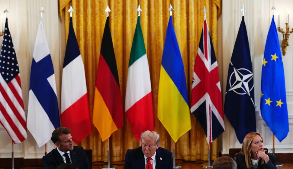 epa12308653 United States President Donald J Trump (C) makes remarks next to French President Emmanuel Macron (L) and Italian Prime Minister Giorgia Meloni (R) during a Multilateral Meeting with European Leaders in the East Room of the White House in Washington, DC, USA, 18 August 2025. European Leaders are at the White House in support of President Zelenskyy following President Trump?s meeting with President Vladimir Putin of Russia in Anchorage, Alaska, USA, on August 15, 2025. EPA/AARON SCHWARTZ/POOL
