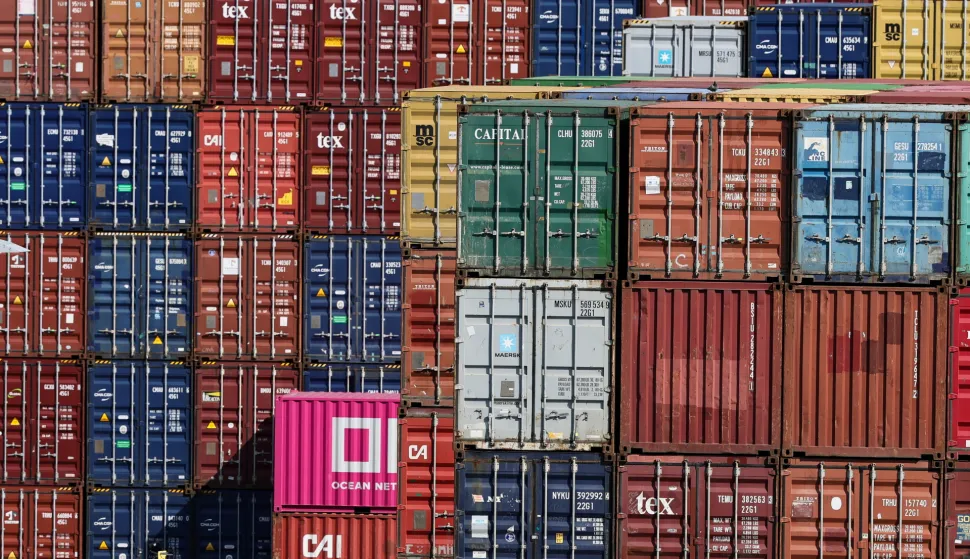 epa12270091 Shipping containers stacked at the Rhine-Neckar commercial port in Mannheim, Germany, 29 July 2025. US President Trump announced plans to impose a 30 percent import duty on products from the European Union (EU) starting 01 August 2025. EPA/RONALD WITTEK