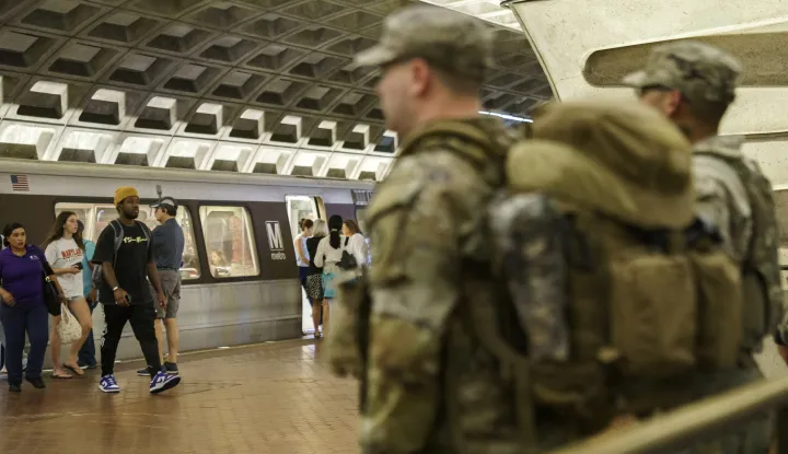 epa12313484 Members of the National Guard patrol inside Metro Center Station in Washington DC, USA, 20 August 2025. As President Trump's takeover of Washington, DC, policing enters its second week, Mississippi joins three other Republican-led states that have vowed to deploy National Guard members in support of the Trump administration's operation. EPA/WILL OLIVER