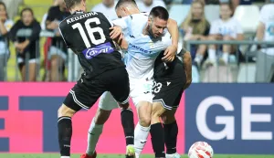 21.08.2025., stadion HNK Rijeka, Rijeka - Prva utakmica doigravanja za ulazak u UEFA Europsku ligu, HNK Rijeka - PAOK. Bear Pascoe,Duje Cop Photo: Nel Pavletic/PIXSELL