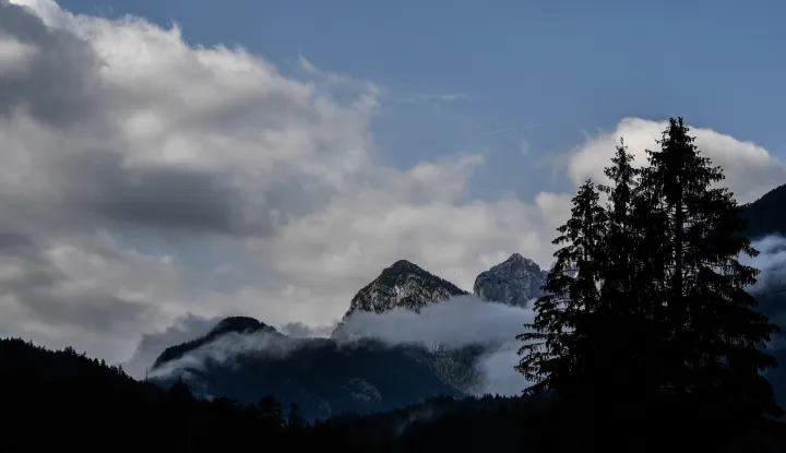 epa06903152 Clouds over mountains in Triglav National Park, near Kranjska Gora, Slovenia, 21 July 2018. About 880 square kilometres Triglav National Park is one of the largest and oldest national reserves in Europe. EPA/FILIP SINGER