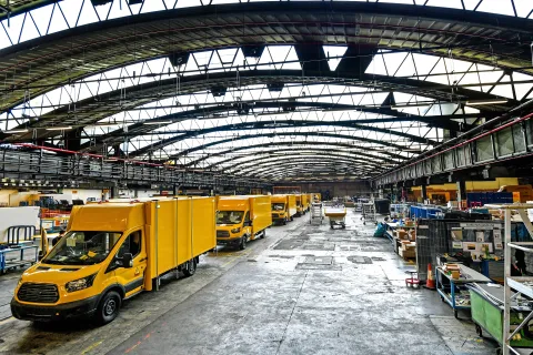 epa07080969 New electric transporters sit in line on the StreetScooter Work XL production line of the US car manufacturer's plant Ford in Cologne-Niehl, Germany, 09 October 2018. The Series production of the StreetScooter Work XL electric transporter, which Ford produces in partnership with StreetScooter GmbH, a subsidiary of Deutsche Post DHL Group, begins at the Ford plant in Cologne-Niehl. EPA/SASCHA STEINBACH