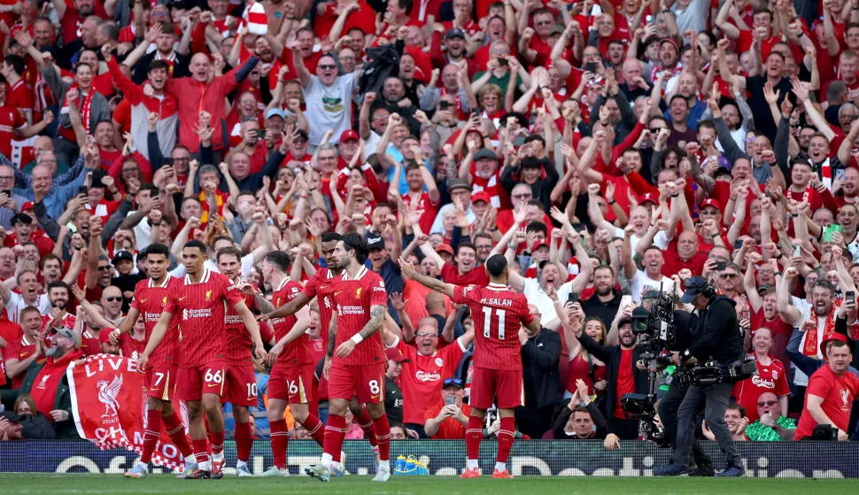 epa12058952 Mohamed Salah of Liverpool celebrates with fans after scoring his team's fourth goal during the English Premier League soccer match between Liverpool FC and Tottenham Hotspur, in Liverpool, Britain, 27 April 2025. EPA/ADAM VAUGHAN EDITORIAL USE ONLY. No use with unauthorized audio, video, data, fixture lists, club/league logos, 'live' services or NFTs. Online in-match use limited to 120 images, no video emulation. No use in betting, games or single club/league/player publications.