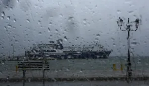 epa07054001 An anchored ship is seen through a car's window, at the port of Rafina, near Athens, Greece, 28 September 2018. Greece's civil protection services announced that authorities are on full alert ahead of the arrival of a tropical-like cyclone expected in the next few hours as they warned the public to expect winds between 80 and 100kph (9-10 Beaufort) with heavy rain and storms, especially in the southern Peloponnese, Crete and western Cyclades islands. EPA/YANNIS KOLESIDIS