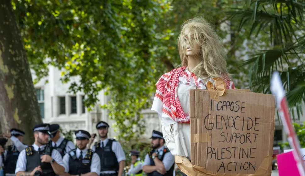 epa12357195 Supporters of the banned group Palestine Action stage a civil disobedience protest in Parliament Square in London, Britain, 06 September 2025. The Metropolitan Police made arrests during the demonstration supporting Palestine Action, designated a proscribed terrorist organization by the British government from 05 July 2025. EPA/TAYFUN SALCI