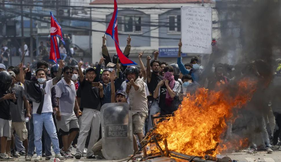 epa12362072 Protesters clash with police in front of the parliament building in Kathmandu, Nepal, 08 September 2025. Young demonstrators gathered in the capital to demand an end to corruption and the lifting of social media bans. The government shut down 26 platforms, including Facebook, YouTube, Instagram, and WhatsApp, after they refused to register in Nepal. At least six people were killed and dozens were injured during the protest. EPA/NARENDRA SHRESTHA