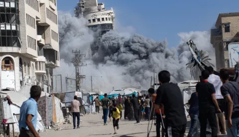 epaselect epa12362349 Palestinians react as the al-Roya residential building is hit by an Israeli airstrike in the west of Gaza City, Gaza Strip, 08 September 2025. Israel confirmed the strike, claiming the building was housing 'intelligence gathering means'. EPA/HAITHAM IMAD