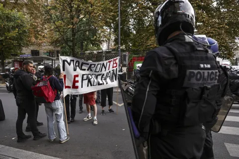 epa12362938 Police officers block a group of people carrying a banner reading 'Macron, you're next' during a spontaneous rally following the rejection of the vote of confidence requested for Prime Minister Fran&ccedil;ois Bayou, in Montreuil, Paris, France, 08 September 2025. French Prime Minister Francois Bayrou has lost the vote of confidence after he activated Article 49.1 of the Constitution. EPA/TERESA SUAREZ