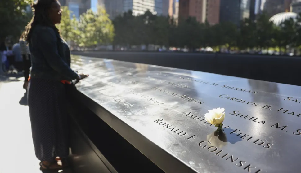 epa12369588 A person visits the South Tower Pool during 24th anniversary 9/11 Commemoration Ceremony at the 9/11 Memorial in New York, New York, USA, 11 September 2025. EPA/SARAH YENESEL