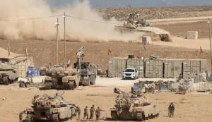epa12366692 Israeli military vehicles gather near the border fence with the Gaza Strip, as seen from the Israeli side of the border, in southern Israel, 10 September 2025. Israel's military said it is stepping up logistical and operational preparations ahead of expanded combat operations. EPA/ABIR SULTAN EPA
