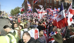 epa12372865 Supporters of 'Unite the Kingdom' protest march gather in central London, Britain, 13 September 2025. Two opposing demonstrations are being held simultaneously in London: one led by Tommy Robinson, called 'Unite the Kingdom,' and another by 'Stand Up to Racism.' EPA/TAYFUN SALCI