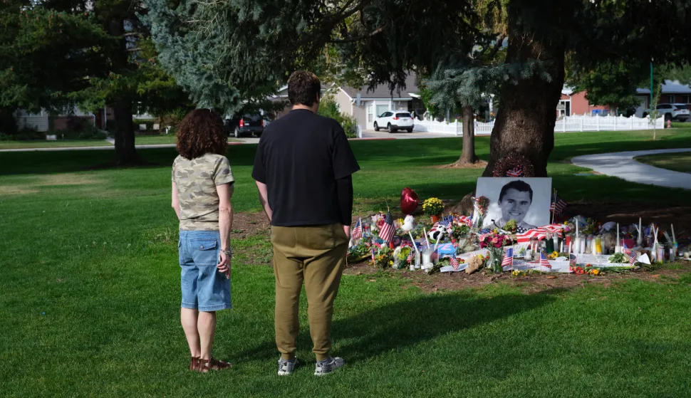 epa12373918 People look at tributes to slain conservative political activist Charlie Kirk, in Provo, Utah, USA, 12 September 2025 (issued 13 September 2025). Kirk was shot and killed on 10 September during a stop on his American Comeback Tour organized by Turning Point USA at Utah Valley University. Tyler Robinson has been arrested and identified as the suspected shooter. EPA/LINDSAY D'ADDATO