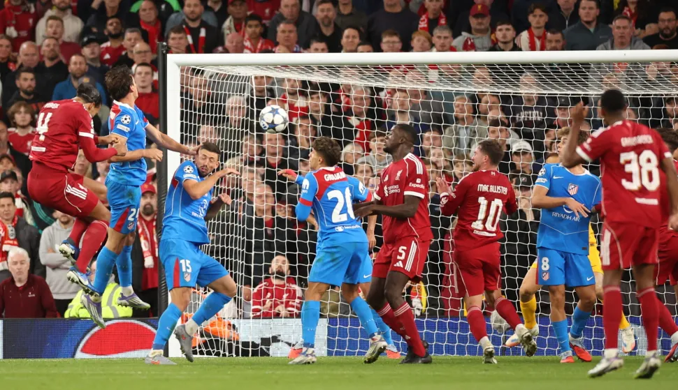 epa12385856 Liverpool's Virgil van Dijk scores the 3-2 during the UEFA Champions League league phase match between Liverpool and Atletico Madrid in Liverpool, Britain, 17 September 2025. EPA/ADAM VAUGHAN