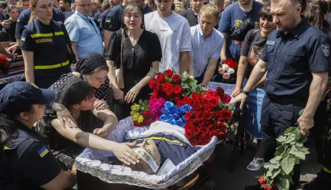 epa12166258 Relatives, friends, and comrades attend a farewell ceremony for three deceased Ukrainian rescuers at the rescue unit in Kyiv, Ukraine, 09 June 2025, amid the Russian invasion. Ukrainian rescuers Pavlo Yezghor, Danylo Skadin, and Andrii Remennyi were killed in a Russian strike as they were responding to the first explosions on 06 June 2025, during the massive combined Russian attack by drones and rockets in Kyiv. EPA/SERGEY DOLZHENKO