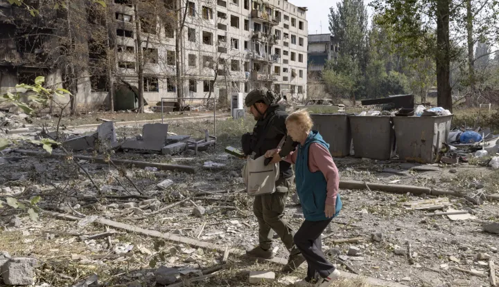 epa12385737 Members of the special Ukrainian police unit 'White Angels' assist an elderly local woman, Nina, 73, as they evacuate her from the frontline city of Kostyantynivka, Donetsk region, eastern Ukraine, 16 September 2025 (issued 17 September 2025), amid the Russian invasion. According to the Ministry of Internal Affairs of Ukraine, more than 6,000 residents, mostly elderly people, remain in Kostiantynivka. The White Angels are a special police unit that provides humanitarian aid, conducts evacuations, and delivers medical assistance in high-risk frontline communities in the Donetsk region. EPA/YEVHEN TITOV