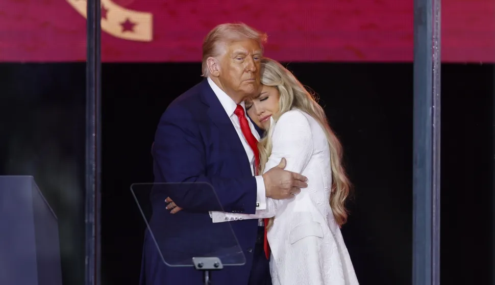 epaselect epa12396897 US President&nbsp;Donald Trump (L) and Erika Kirk (R), wife of Charlie Kirk, embrace on stage during the public memorial service of political activist Charlie Kirk at State Farm Stadium in Glendale, Arizona, USA, 21 September 2025. Kirk was shot and killed on 10 September during a stop on his American Comeback Tour organized by Turning Point USA at Utah Valley University. EPA/CAROLINE BREHMAN