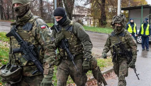epa10308480 Polish Army soldiers and Polish Police during operational activities in Przewodow, Lublin Voivodeship, Poland, 16 November 2022. Poland has raised military readiness after a missile explosion killed two civilians in Przewodow, a Polish village near the border with Ukraine, November 15. 'The missile which fell on Polish territory was probably a 1970s Russian product. We have no proof of its being fired from Russia. It is highly probable that it belonged to the Ukrainian defence forces,' President Andrzej Duda said in a statement on 16 November. EPA/WOJTEK JARGILO POLAND OUT