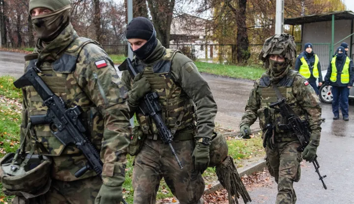 epa10308480 Polish Army soldiers and Polish Police during operational activities in Przewodow, Lublin Voivodeship, Poland, 16 November 2022. Poland has raised military readiness after a missile explosion killed two civilians in Przewodow, a Polish village near the border with Ukraine, November 15. 'The missile which fell on Polish territory was probably a 1970s Russian product. We have no proof of its being fired from Russia. It is highly probable that it belonged to the Ukrainian defence forces,' President Andrzej Duda said in a statement on 16 November. EPA/WOJTEK JARGILO POLAND OUT