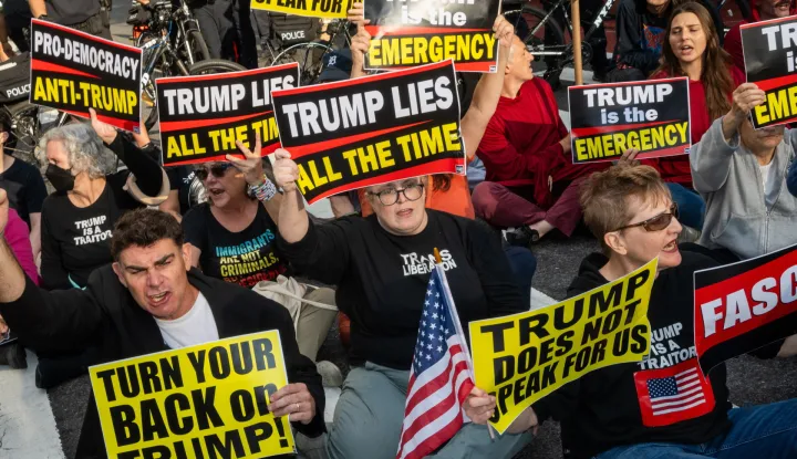 epa12399893 People sit down on the street at a shut down Trump protest outside of United Nations headquarters in New York, New York, USA, 23 September 2025. During the General Debate of the 80th session of the United Nations General Assembly (UNGA), Palestine has been recognised as a state by 157 UN member states. EPA/JOHN TAGGART