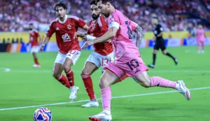 epa12176477 Inter Miami CF's Lionel Messi (R) in action against Al Ahly SC's Marawan Attia during the FIFA Club World Cup 2025 group stage match between Al Ahly SC and Inter Miami CF at Hard Rock Stadium in Miami, USA, 14 June 2025. EPA/CRISTOBAL HERRERA-ULASHKEVICH