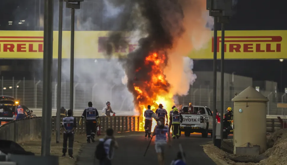 epa08850800 Flames on the crash site of French Formula One driver Romain Grosjean of the Haas F1 Team during the start of the Formula One Grand of Bahrain on the Bahrain International Circuit in Sakhir, Bahrain, 29 November 2020. EPA/Kamran Jebreili/Pool