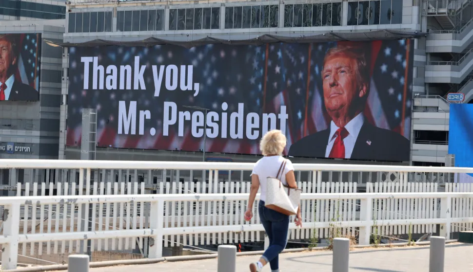 epa12190499 A woman walks past a billboard thanking US President Donald Trump in Tel Aviv, Israel, 22 June 2025. The US forces struck three of Iran's key nuclear sites: Natanz, Isfahan and Fordo, US President Trump announced on 21 June, amid an escalating conflict between Iran and Israel since 13 June. EPA/ABIR SULTAN