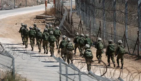 epa12252592 Israeli soldiers patrolling at the ceasefire line, near the Israeli-annexed Golan Heights village of Majdal Shams, 22 July 2025. EPA/ATEF SAFADI