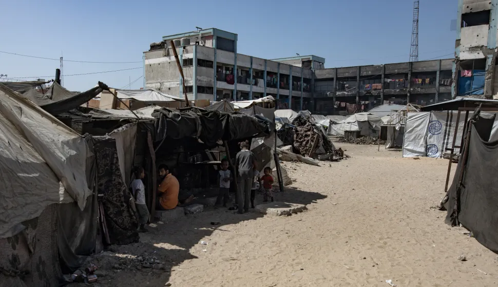 epa12432234 Internally displaced Palestinians gather among tents in Khan Younis, southern Gaza Strip, 5 October 2025. According to the UN around 90 percent of the population or 1.9 million people in Gaza have been displaced since the start of the conflict. More than 67,000 Palestinians have been killed in the Gaza Strip since October 2023, according to the Palestinian Ministry of Health, and about 1,200 Israelis have been killed since the launch of an Israeli military campaign in response to a cross-border attack by Hamas on 07 October 2023. EPA/HAITHAM IMAD