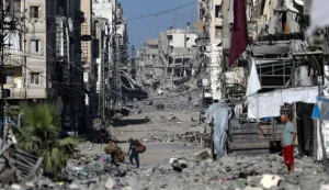 epa12438380 Palestinians move on the damaged Al-Nassr street during an Israeli military operation in Gaza City, Gaza Strip, 07 October 2025. According to the UN around 90 percent of the population or 1.9 million people in Gaza have been displaced since the start of the conflict. More than 67,000 Palestinians have been killed in the Gaza Strip since October 2023, according to the Palestinian Ministry of Health, and about 1,200 Israelis have been killed since the launch of an Israeli military campaign in response to a cross-border attack by Hamas on 07 October 2023. EPA/MOHAMMED SABER