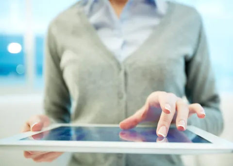 Hands of white collar worker using touchpad
