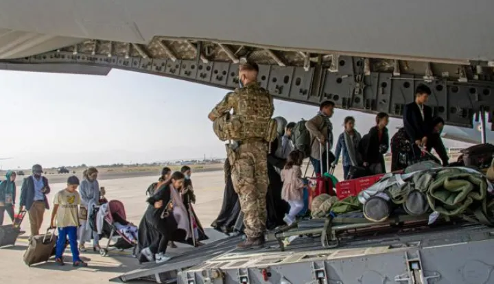 epa09418813 A handout picture provided by the British Ministry of Defence (MOD) shows British citizens and dual nationals residing boarding a military plane at the airport in Kabul, Afghanistan, 16 August 2021 (issued 18 AAugust 2021) As part of Operation PITTING, the UK Armed Forces are enabling the evacuation of British personnel from Afghanistan. On 16 August the first flight of evacuated personnel arrived at RAF Brize Norton in the UK. The flight constituted of British Embassy staff and British Nationals. EPA/LPhot Ben Shread/BRITISH MINISTRY OF DEFENCE/HANDOUT MANDATORY CREDIT: MOD/CROWN COPYRIGHTATTTENTION EDITORS: ** Some blurring of faces has been applied to protect identities **** Some blurring of faces has been applied by source to protect identities ** HANDOUT EDITORIAL USE ONLY/NO SALES