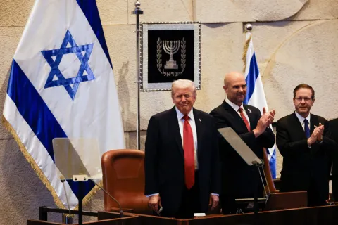 epa12450525 US President Donald Trump (L) reacts next to Amir Ohana (C), Speaker of the Israeli Knesset, and Israeli President Isaac Herzog during an address to the Israeli parliament, the Knesset, in Jerusalem, 13 October 2025. Hamas handed over the 20 surviving Israeli hostages on October 13 under a ceasefire agreement, as the US president and other world leaders geared up for a summit on Gaza. The releases are part of a ceasefire agreement brokered by the US president, with Israel due in return to free nearly 2,000 detainees held in its jails in exchange. EPA/JALAA MAREY/POOL