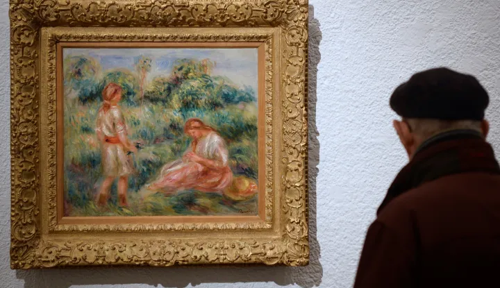 epa07297051 A visitor observes the artwork 'Femme et jeune fille dans un paysage' (lit. Woman and girl in a landscape) by French artist Pierre-Auguste Renoir during the opening of the exhibition 'Los antimodernos. De Renoir a Torres GarcA­a' (lit. The anti-modern. From Renoir to Torres Garcia) at Sala del Museo de la Pasion museum in Valladolid, Spain, 19 January 2019. The exhibition features 35 artworks about the crisis of Modernity and runs from 19 January to 31 March 2019. EPA/NACHO GALLEGO