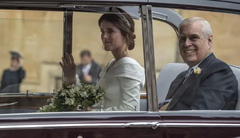 epa07087844 Britain's Prince Andrew, Duke of York (R) and Princess Eugenie (L) arrive for her royal wedding ceremony with Jack Brooksbank at St George's Chapel at Windsor Castle, in Windsor, Britain, 12 October 2018. EPA/WILL OLIVER