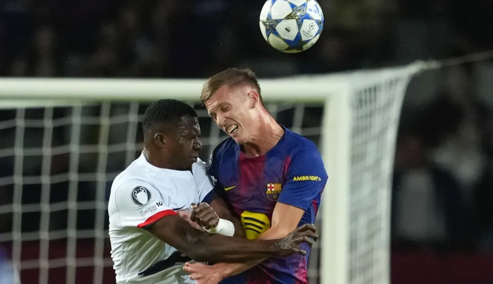 epa12421668 FC Barcelona's Dani Olmo (R) in action against PSG's Willian Pacho during the UEFA Champions League league phase soccer match between FC Barcelona and PSG, in Barcelona, Spain, 01 October 2025. EPA/Alejandro Garcia