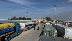 epa11836089 Trucks carrying humanitarian aid bound for the Gaza Strip wait to cross the Rafah border crossing between the Gaza Strip and Egypt, in Rafah, Egypt, 19 January 2024. Israel and Hamas agreed on a hostage release deal and a Gaza ceasefire to be implemented on 19 January 2025. More than 46,000 Palestinians have been killed in the Gaza Strip, according to the Palestinian Ministry of Health, since Israel launched a military campaign in the strip in response to a cross-border attack led by the Palestinian militant group Hamas on 07 October 2023, in which about 1,200 Israelis were killed and more than 250 taken hostage. EPA/MOHAMED HOSSAM