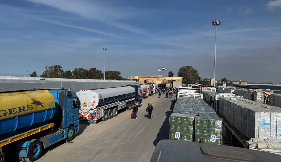 epa11836089 Trucks carrying humanitarian aid bound for the Gaza Strip wait to cross the Rafah border crossing between the Gaza Strip and Egypt, in Rafah, Egypt, 19 January 2024. Israel and Hamas agreed on a hostage release deal and a Gaza ceasefire to be implemented on 19 January 2025. More than 46,000 Palestinians have been killed in the Gaza Strip, according to the Palestinian Ministry of Health, since Israel launched a military campaign in the strip in response to a cross-border attack led by the Palestinian militant group Hamas on 07 October 2023, in which about 1,200 Israelis were killed and more than 250 taken hostage. EPA/MOHAMED HOSSAM