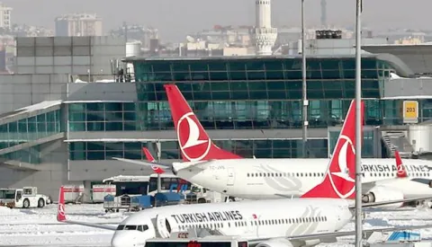 epa05720383 (FILE) - A file picture dated 08 January 2017 shows Turkish Airlines planes and aircraft of other international airlines being grounded at the Ataturk international airport in Istanbul, Turkey. According to media reports on 16 January 2017, Turkish Airlines Flight 6491 crashed into a residential area near the Kyrgyzstan capital of Bishkek, killing the pilot and at least 20 people on the ground, while en route from Hong Kong to Manas International Airport. The plane was carrying cargo to Istambul. There is currently no information on the number of crew on board at the time of the crash. EPA/SEDAT SUNA