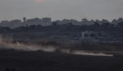 epa12453502 Israeli troops moving in the northern part of the Gaza Strip as seen form the Israeli side of the border near the town of Sderot, following the Israel-Hamas agreement, 14 October 2025, EPA/ATEF SAFADI
