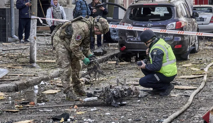 epa12472413 Ukrainian experts inspect debris of a drone at the site of a Russian strike on a kindergarten in Kharkiv, northeastern Ukraine, 22 October 2025, amid the Russian invasion. At least one person was killed and six others injured after Russian strikes hit a kindergarten in Kharkiv, according to the head of the Kharkiv Military Administration, Oleg Synegubov. The 48 children and teachers were safely evacuated to a shelter in the same building. Across Ukraine, the attacks killed at least seven people, including two children, with regions including Kyiv, Odesa, Chernihiv, Dnipropetrovsk, Kirovohrad, Poltava, Vinnytsia, Zaporizhia, Cherkasy, and Sumy affected, according to President Zelensky. EPA/SERGEY KOZLOV